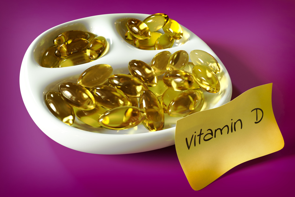 Imagem ilustrativa de capsulas de vitamina D em uma tigela